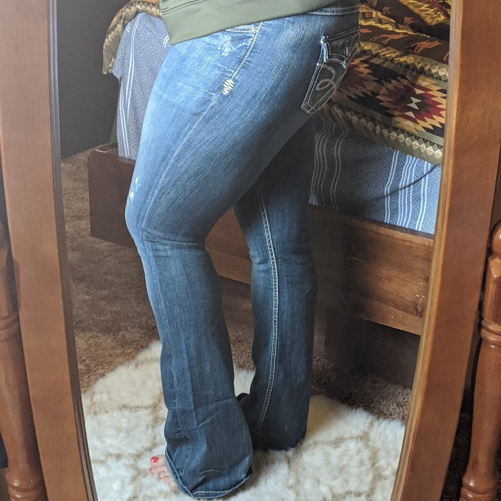 Medium wash jeans, distressed